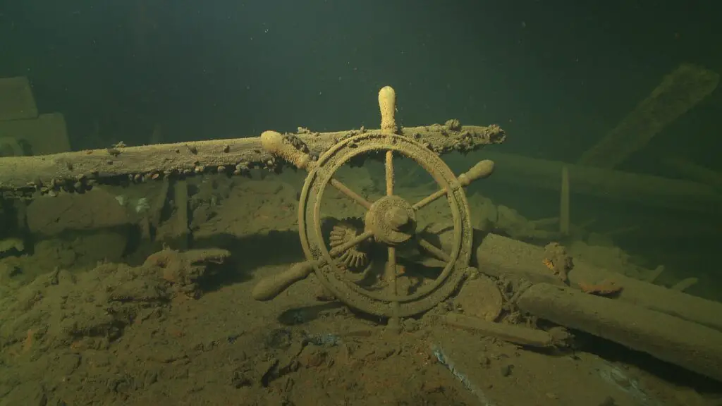 the wheel of a ship under water