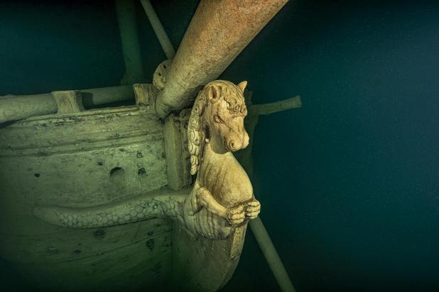 front of a wooden shipwreck