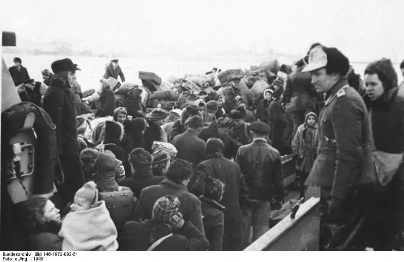 Civilians on a boat escaping war.