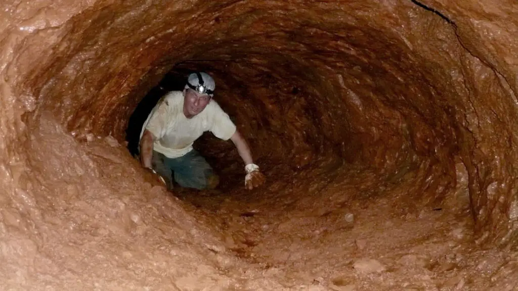 man in a tunnel in a jungle