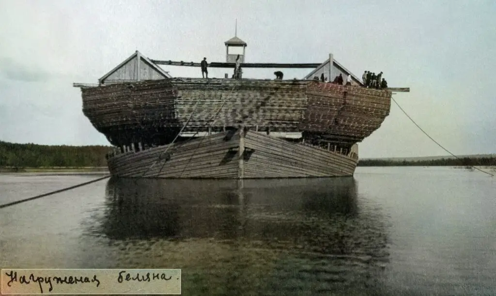 Belyana boat made from logs on a river