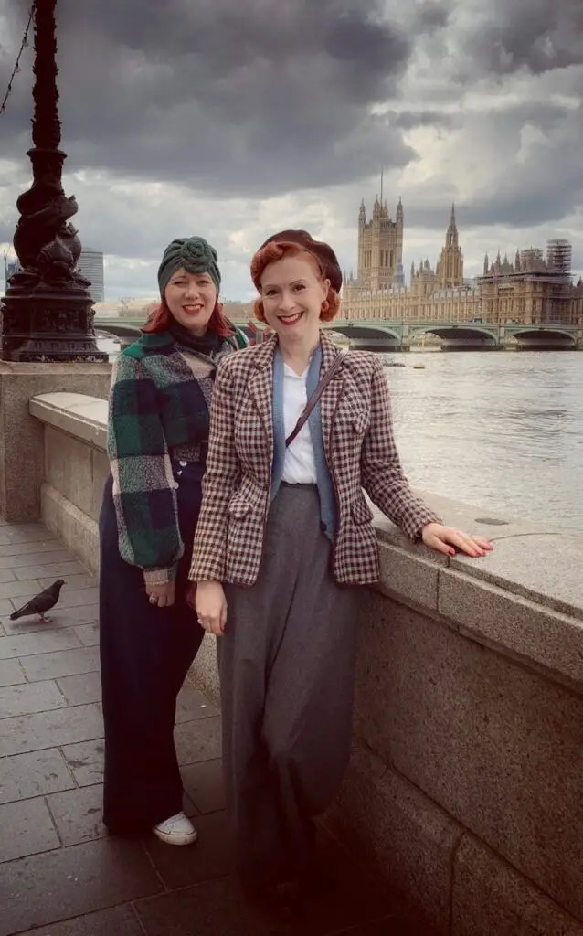 two women dressed in 1940s clothes